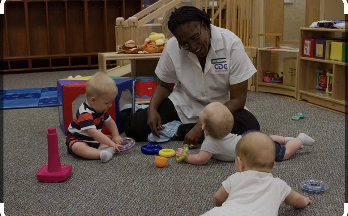 Happy Children Playing with Caregivers