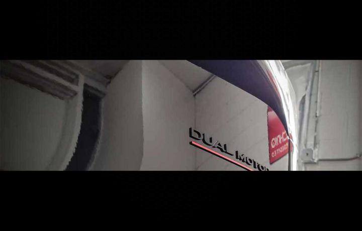 black tesla dual motor emblem